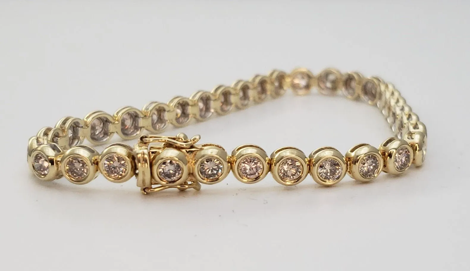 5 Carats Total Weight Diamond Bezel Set 14k Yellow Gold Tennis Bracelet