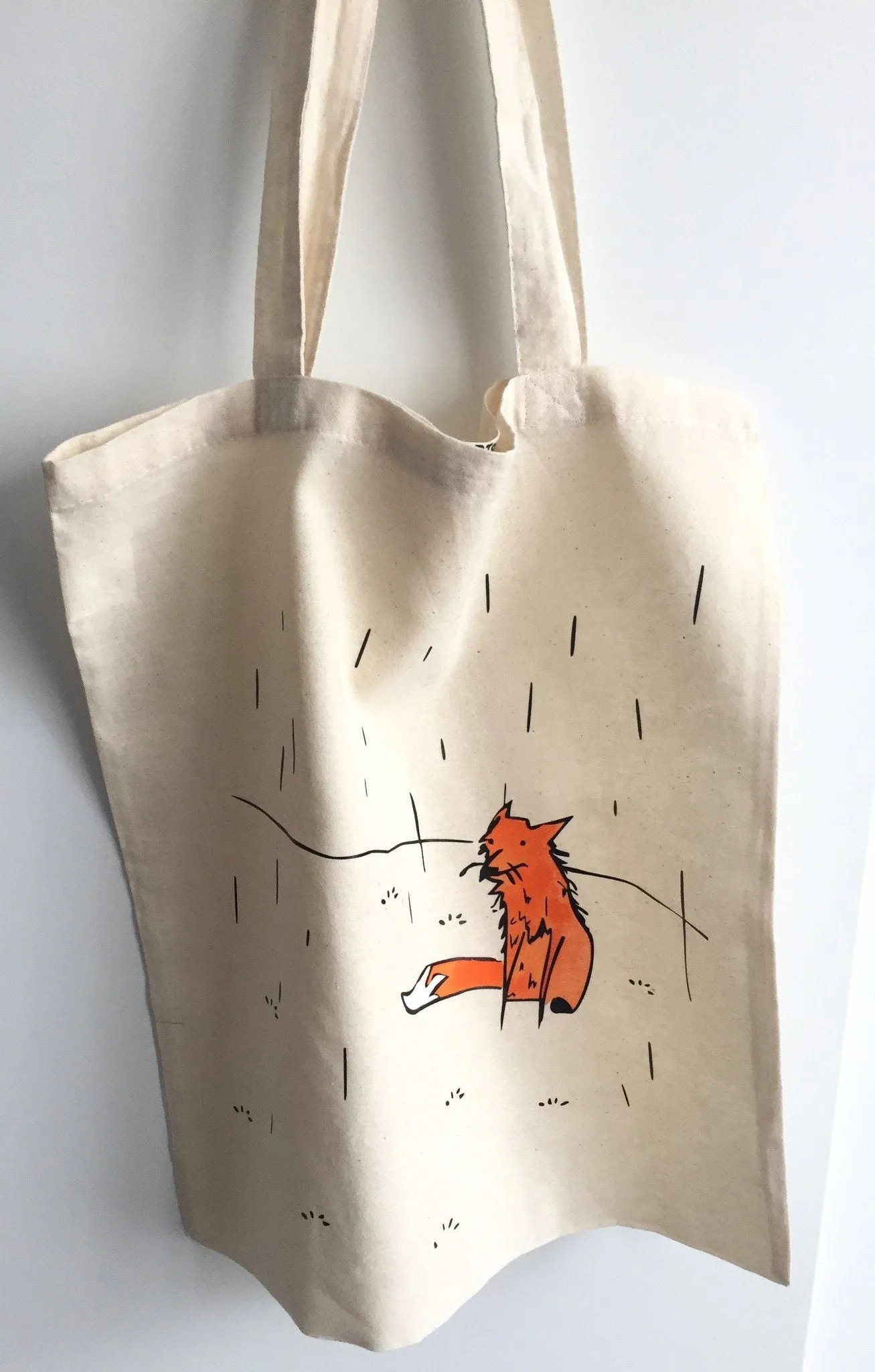 Fox in a rain tote bag